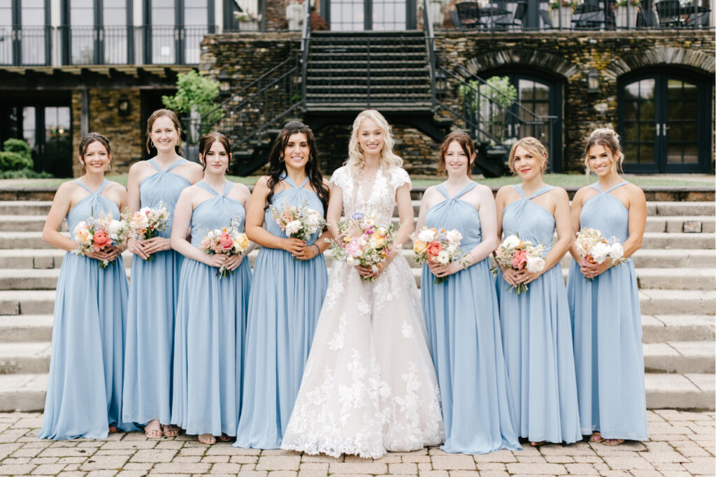 Philadelphia bride with her bridesmaids in light blue halter bridesmaid dresses at The Lake House inn