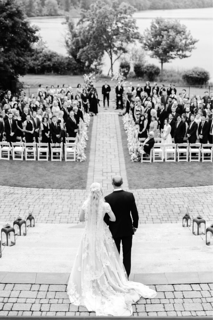 Pennsylvania summer bride walking down the aisle at her outdoor lakeside wedding ceremony