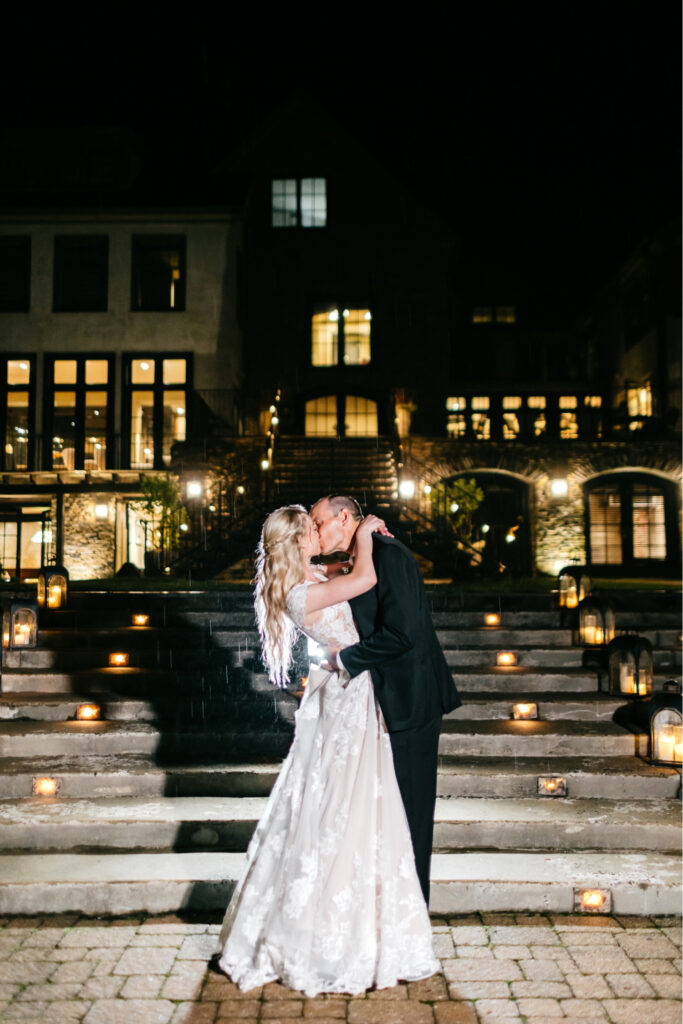 Pennsylvania bride and groom kissing during a night portrait photo session on their summer wedding day at The Lake House Inn by Emily Wren Photography