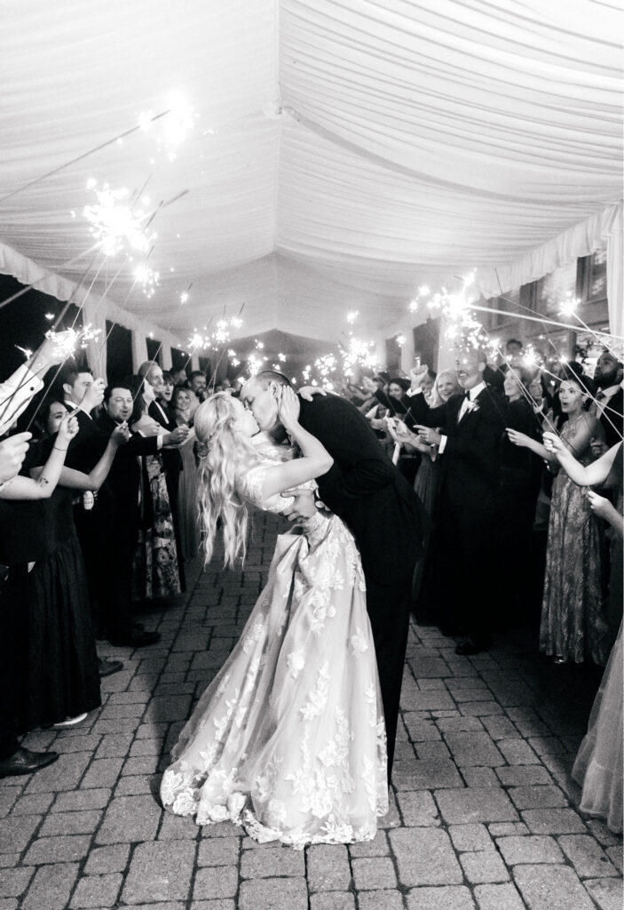bride & groom's sparkler exit from their summer lakeside wedding reception at The Lake House Inn
