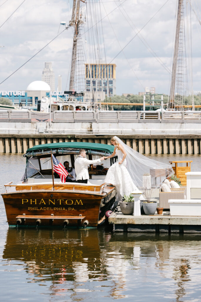 Philadelphia bride boarding the Phantom Boat along Penn's Landing on her late spring wedding day