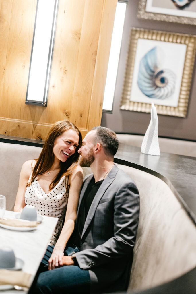 romantic engagement photos inside a Center City Philadelphia restaurant by Emily Wren Photography