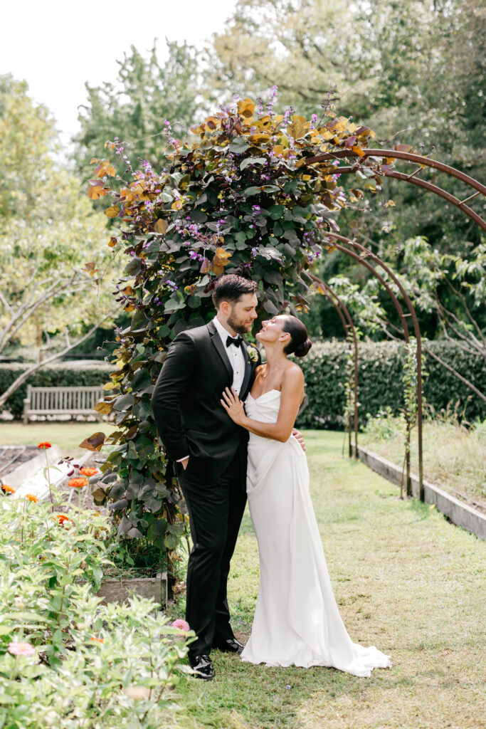 New Jersey bride and groom portrait in Cape May garden on Beach Plum Farm