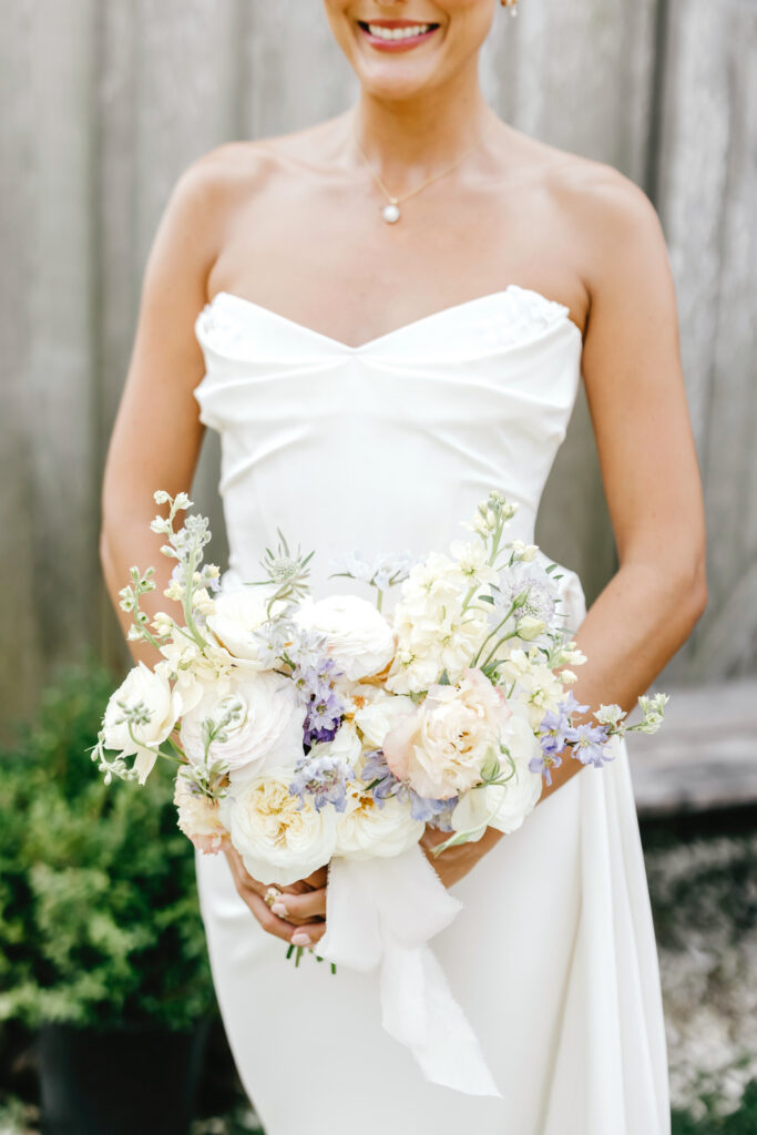 cute summer bridal bouquet with white, pink and purple flowers by Emily Wren Photography