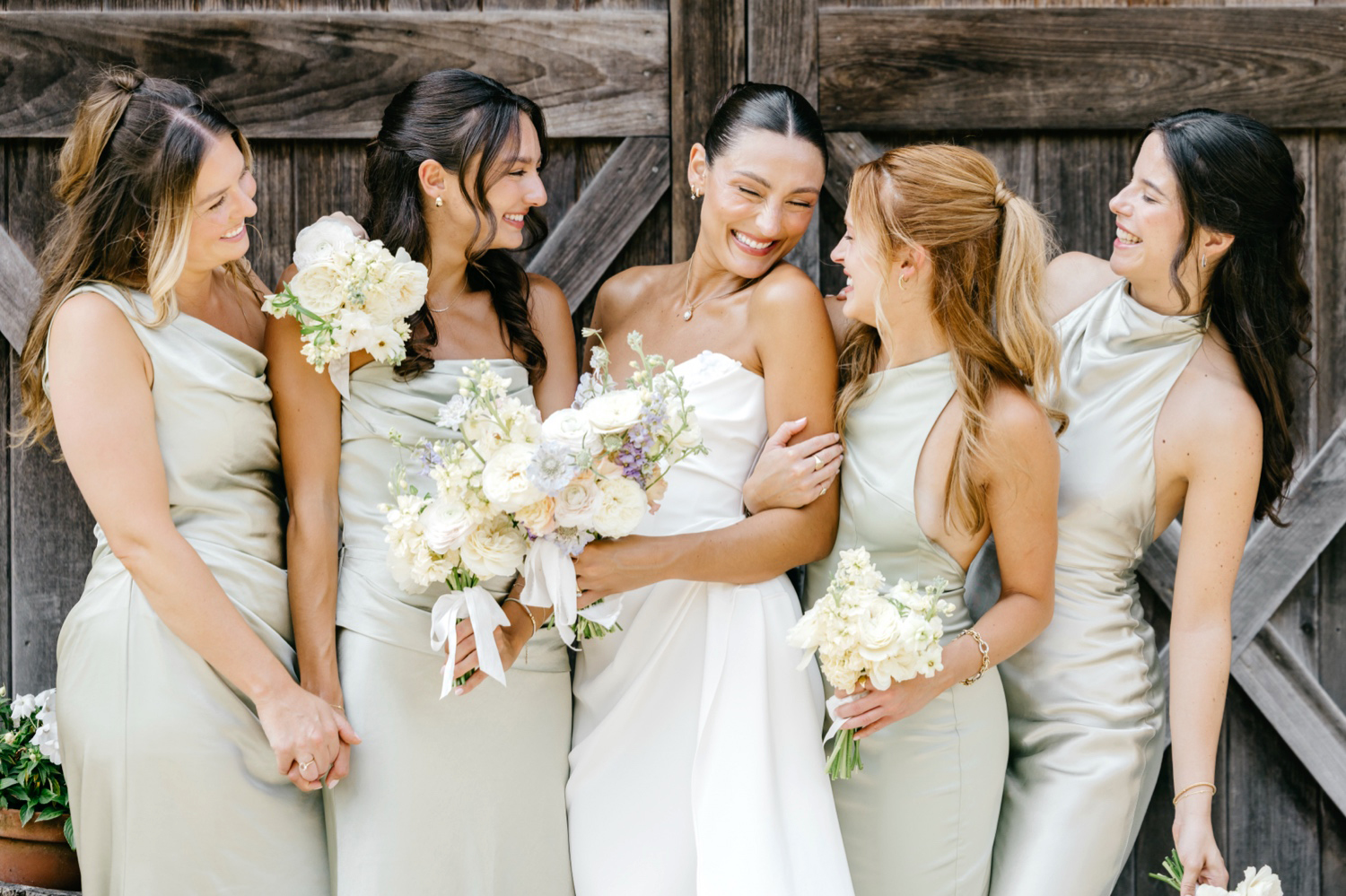 New Jersey bride with her bridesmaids in light green bridesmaid dresses at Beach Plum Farm