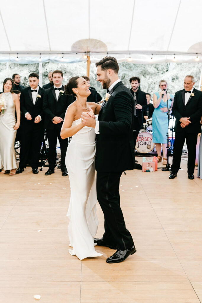 New Jersey bride and groom's first dance at their white tent outdoor summer wedding reception at Beach Plum Farm