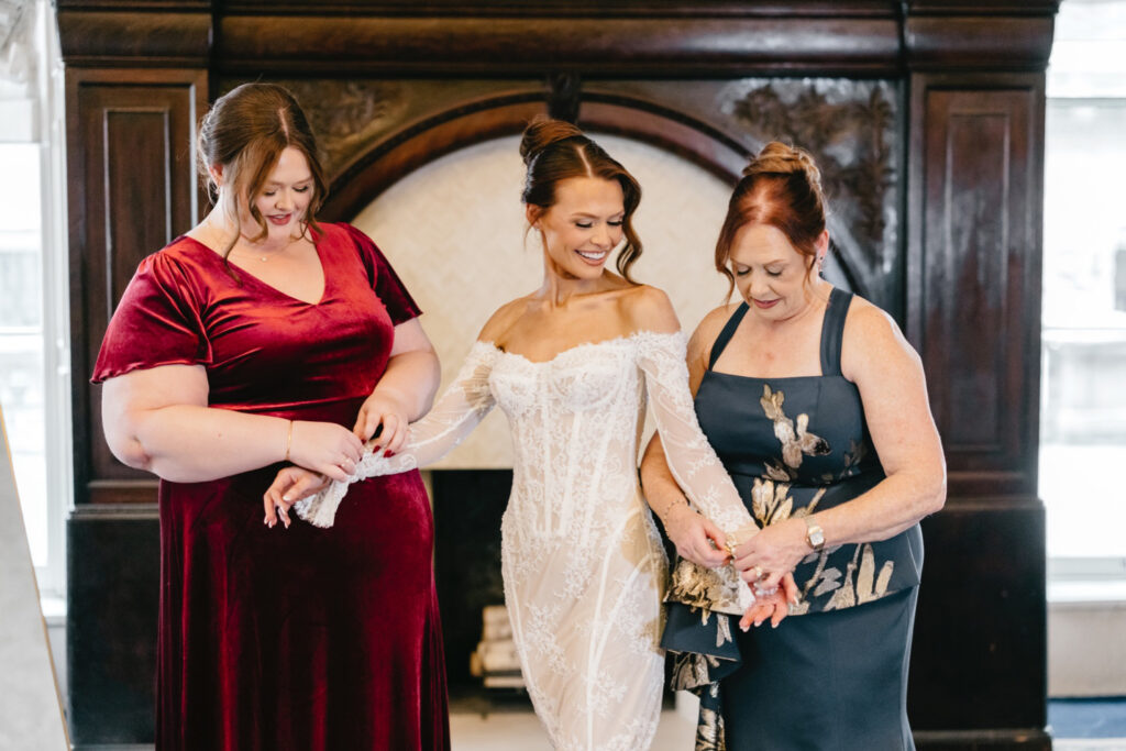 The Philadelphia bride is getting ready for her winter wedding day at The Union League with her mother and bridesmaid