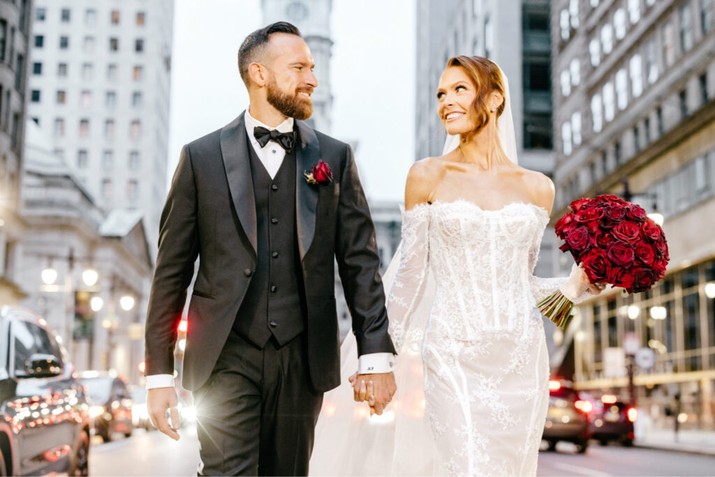sunset portrait of bride and groom on Broad Street in Center City Philadelphia by Emily Wren Photography