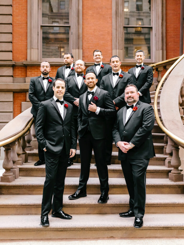 Philadelphia groom with his groomsmen on the stairs of the Union League in Center City
