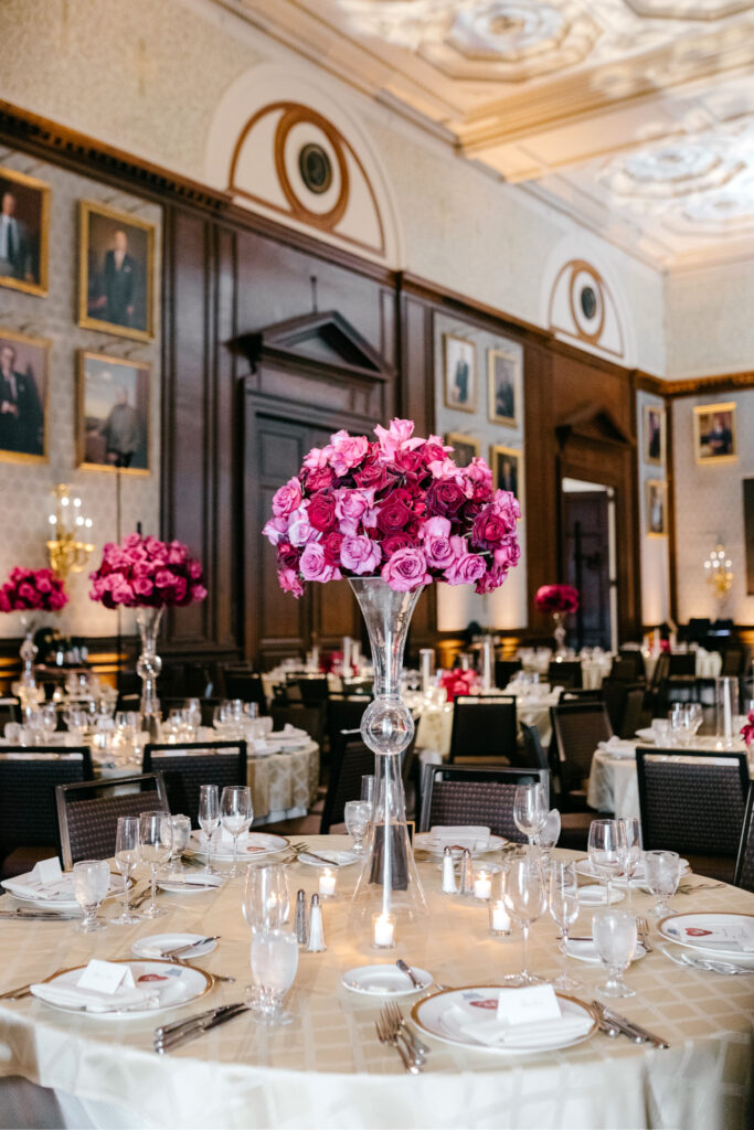 pink and red roses floral displays at luxurious wedding reception at The Union League by Philadelphia wedding photographer Emily Wren Photography