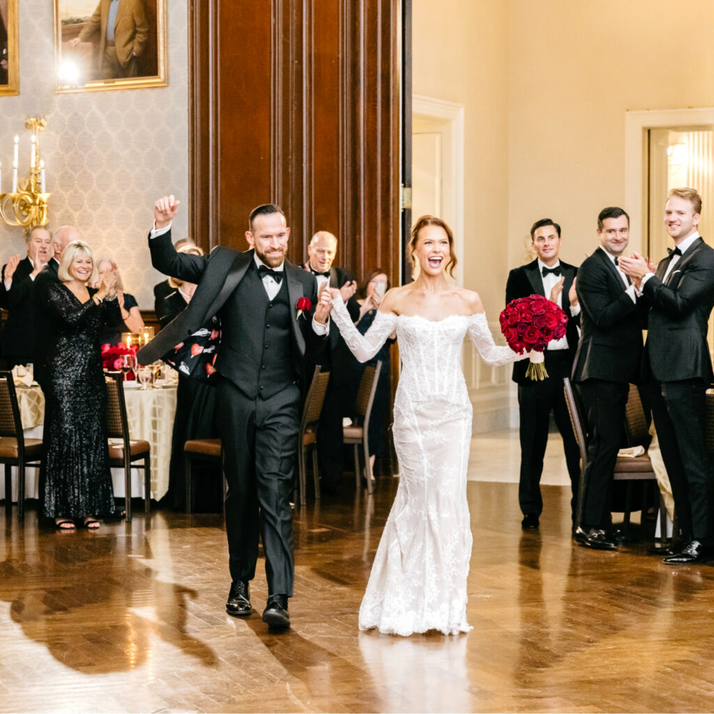 Philadelphia bride and groom entering their luxurious wedding reception at The Union League