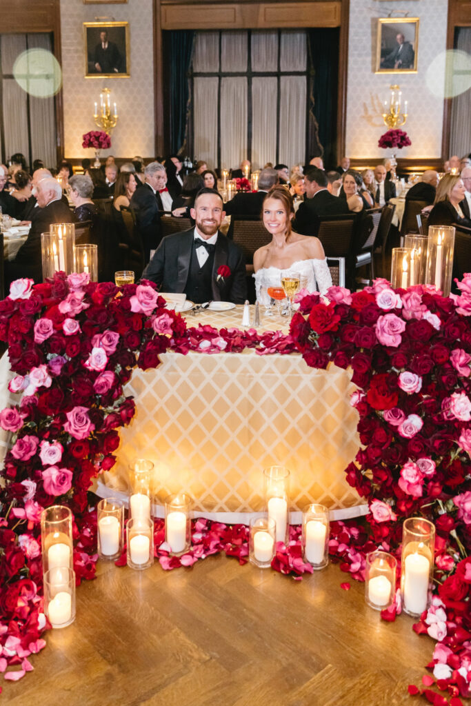 luxurious red and pink roses floral arrangement for a sweetheart table at the Union League wedding reception