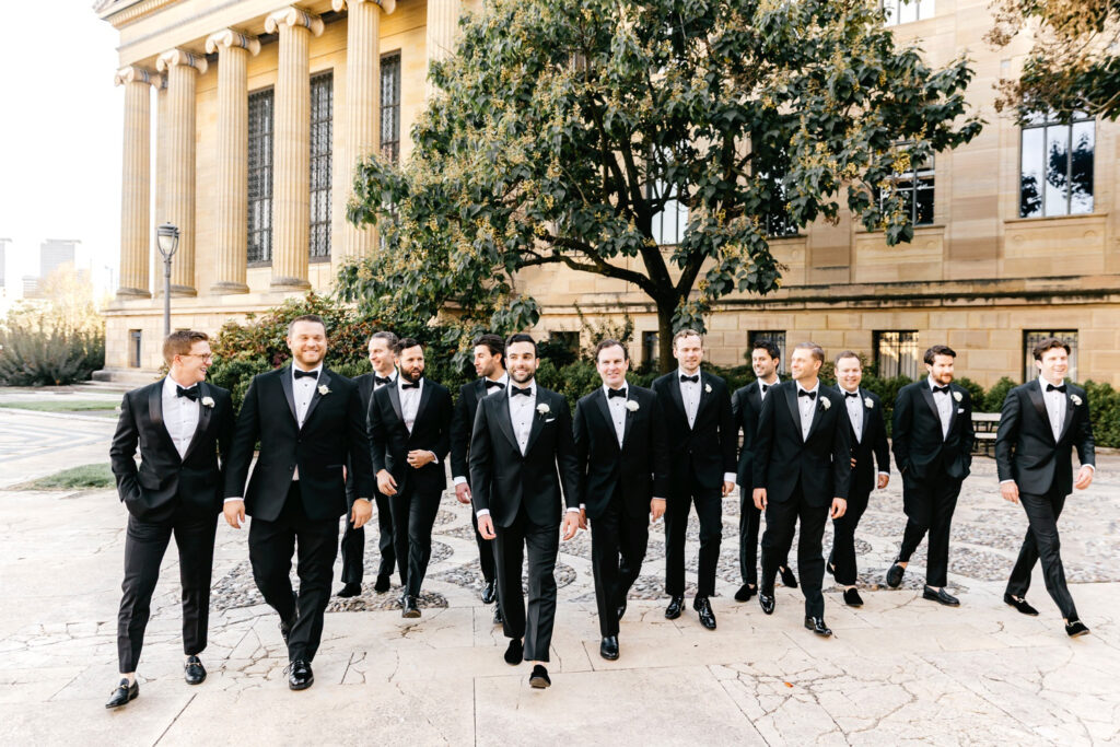 Philadelphia groom with his groomsmen at the Art Museum on fall wedding day.