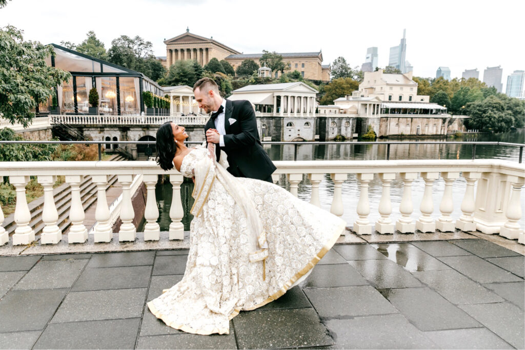 Philadelphia bride and groom on their rainy fall wedding day at Cescaphe's Water Works.