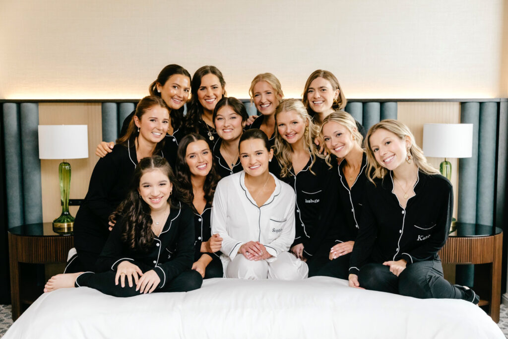 Delaware bride with her bridesmaids in matching black pajama sets