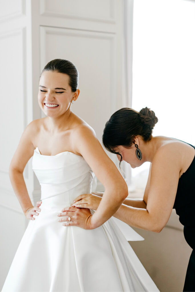 Delaware bride getting ready for her fall wedding day at Hotel Du Pont by Emily Wren Photography