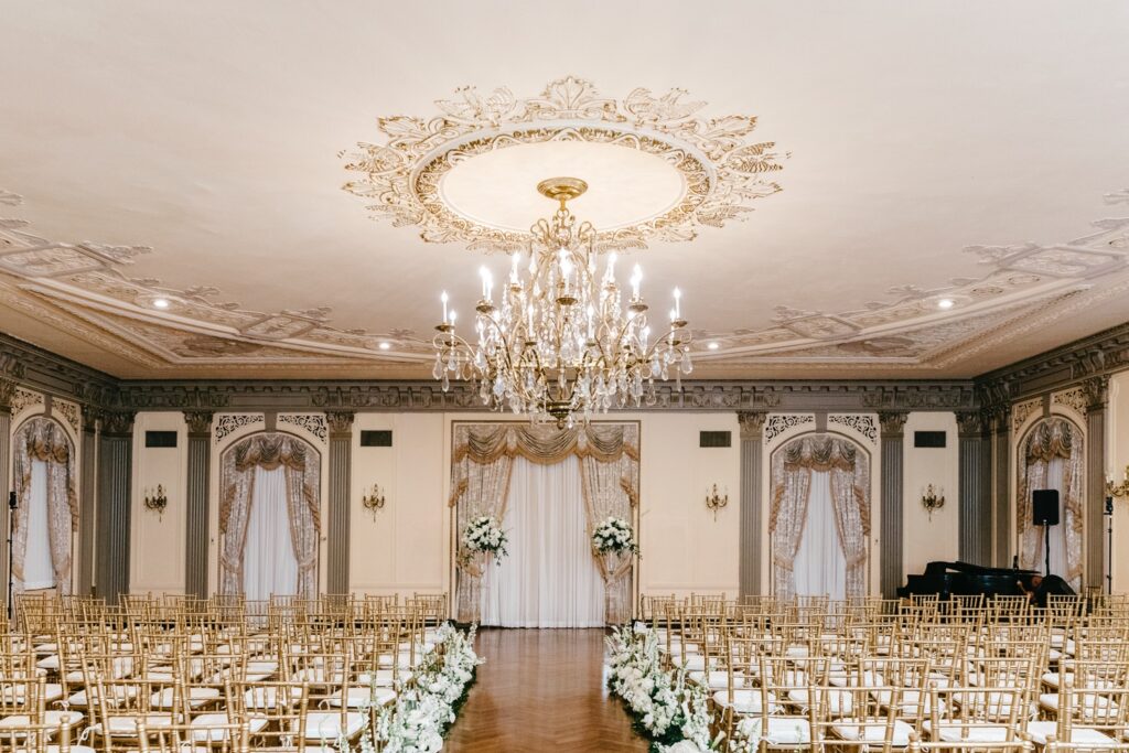 glamorous all-white wedding ceremony at Delaware's Hotel Du Pont ballroom