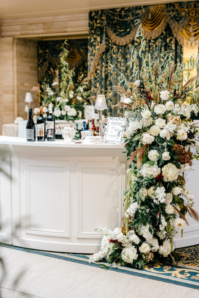 stunning floral display at the bar of a luxurious cocktail hour at Hotel Du Pont