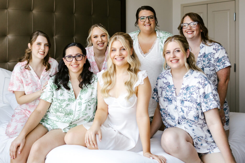 New Hampshire bride with her bridesmaids in coordinating floral silk pajama sets