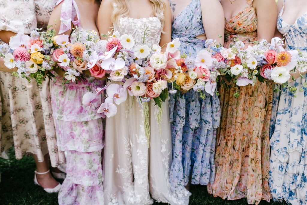 colorful pastel summer bridesmaid bouquets for an outdoor garden wedding ceremony