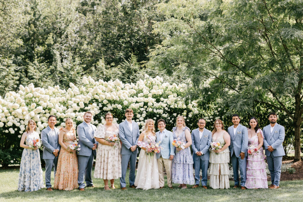 full wedding party on an outdoor summer garden wedding day at Uncanoonuc Mountain