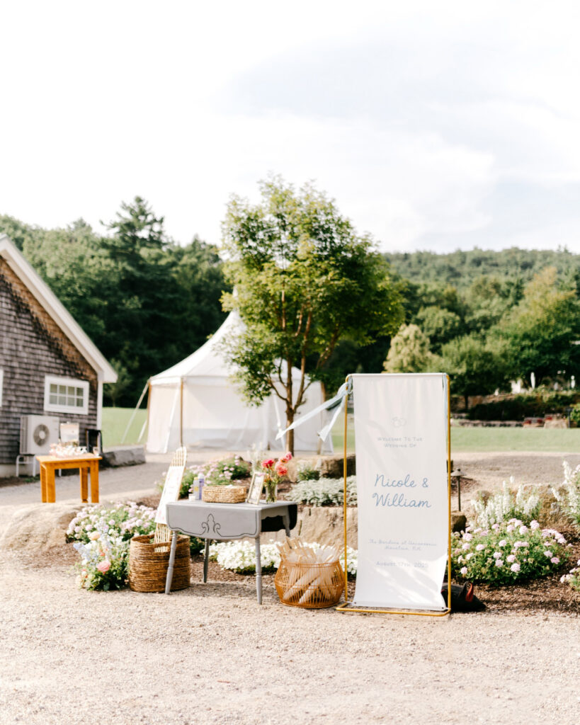 garden-inspired welcome table for outdoor summer wedding ceremony