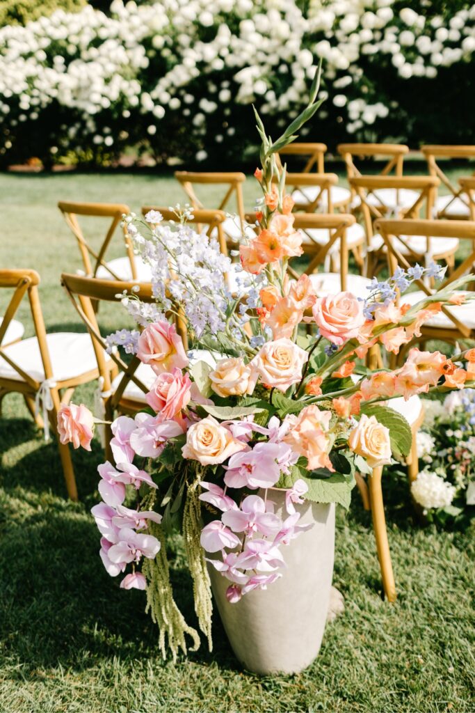 colorful garden flowers along an outdoor wedding ceremony aisle at Uncanoonuc Mountain