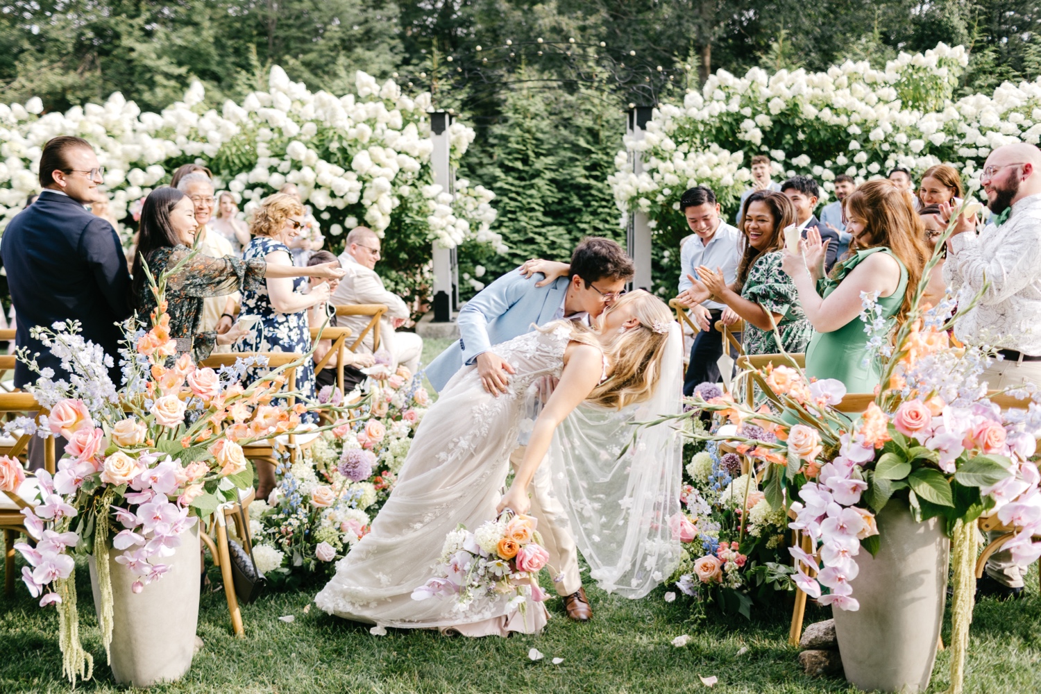 bride and groom exiting their outdoor summer garden wedding ceremony at Uncanoonuc Mountain