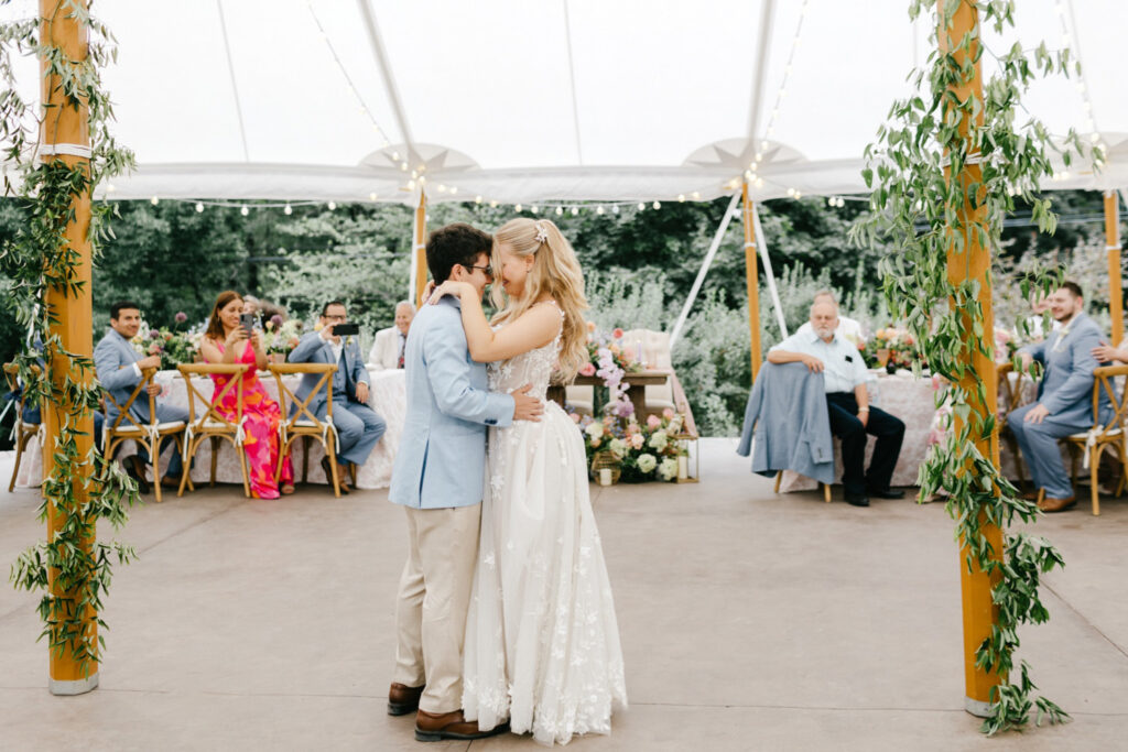 New Hampshire bride and groom's first dance at their Uncanoonuc Mountain white tent wedding reception
