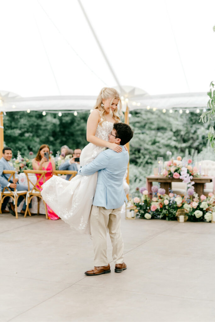 bride and groom's first dance at their summer garden wedding reception at Uncanoonuc Mountain by Emily Wren Photography