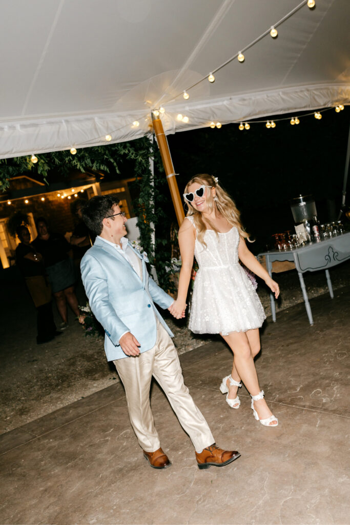 New Hampshire bride and groom at their outdoor summer Uncannonuc Mountain wedding reception by Emily Wren Photography