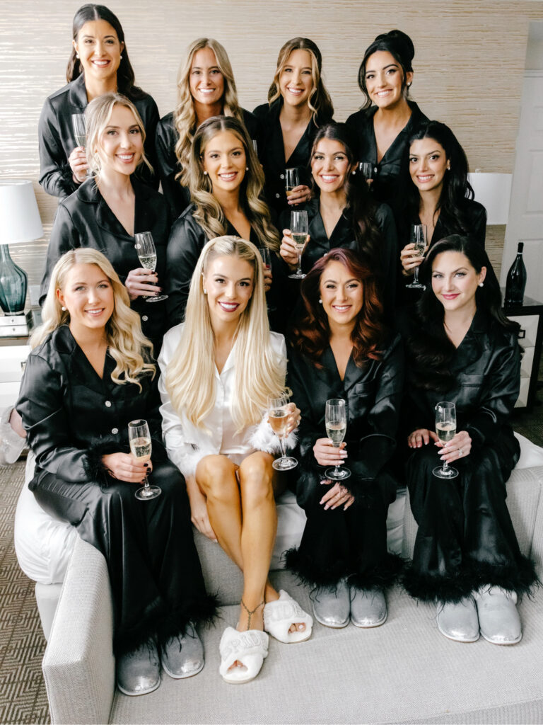Philadelphia bride with her bridesmaids in matching silk pajama sets with fur trim