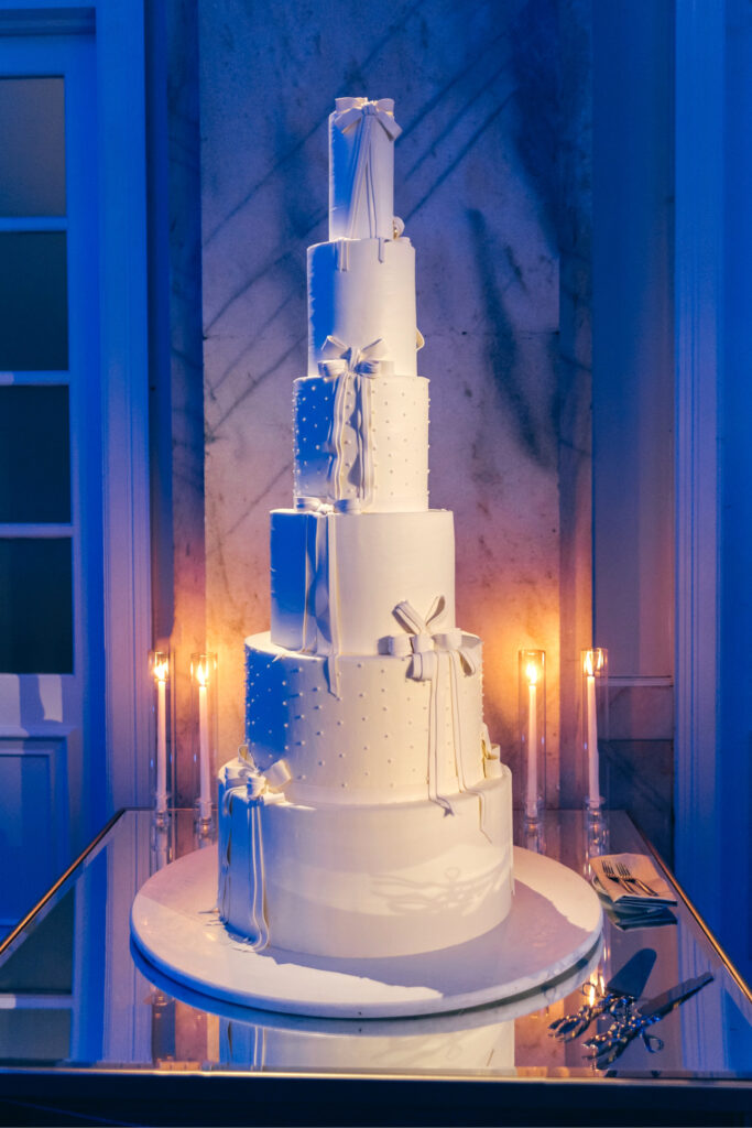 seven-tier all white wedding cake at luxurious Ritz-Carlton winter wedding reception by Emily Wren Photography