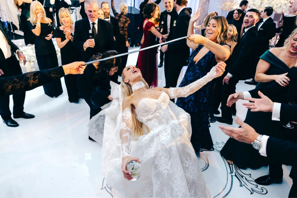 Philadelphia bride having fun at her winter wedding reception at The Ritz-Carlton by Emily Wren Photography
