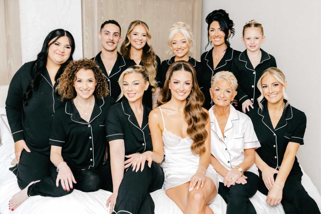 Philadelphia bride with her bridesmaids in match pajama sets by Emily Wren Photography