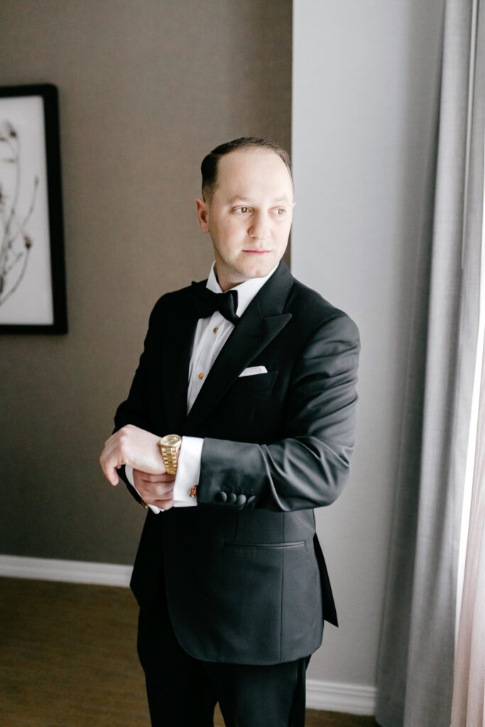 wedding day portrait of Philadelphia groom getting ready at The Westin in Center City