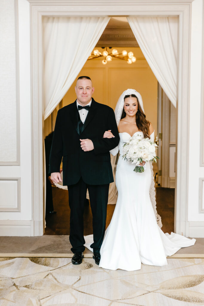 stunning Philadelphia bride walking down the aisle at her indoor wedding ceremony at The Westin Hotel