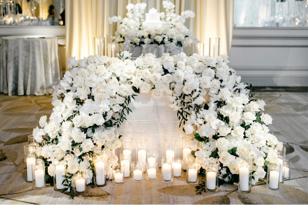 all white wedding reception sweetheart table decorated with white roses at The Westin Philadelphia