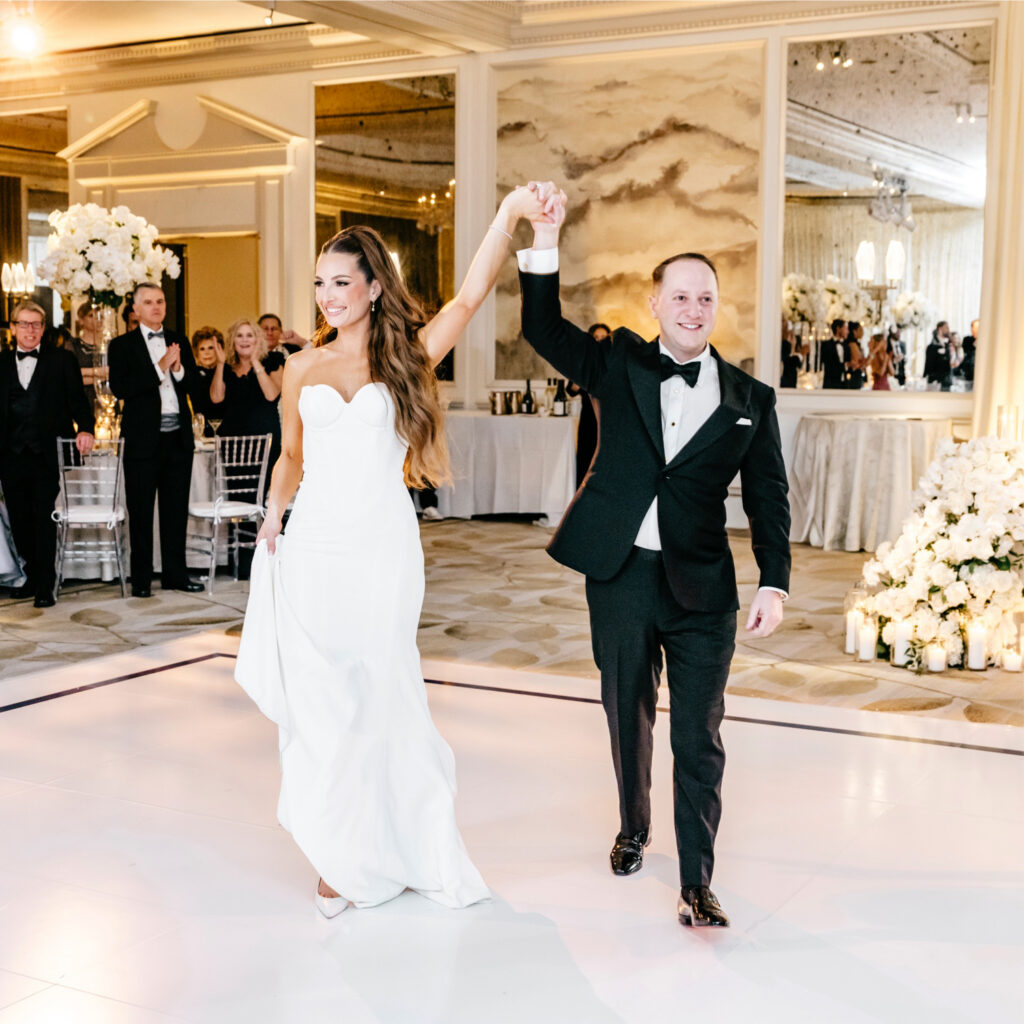 Philadelphia bride and groom entering their luxury wedding reception at The Westin