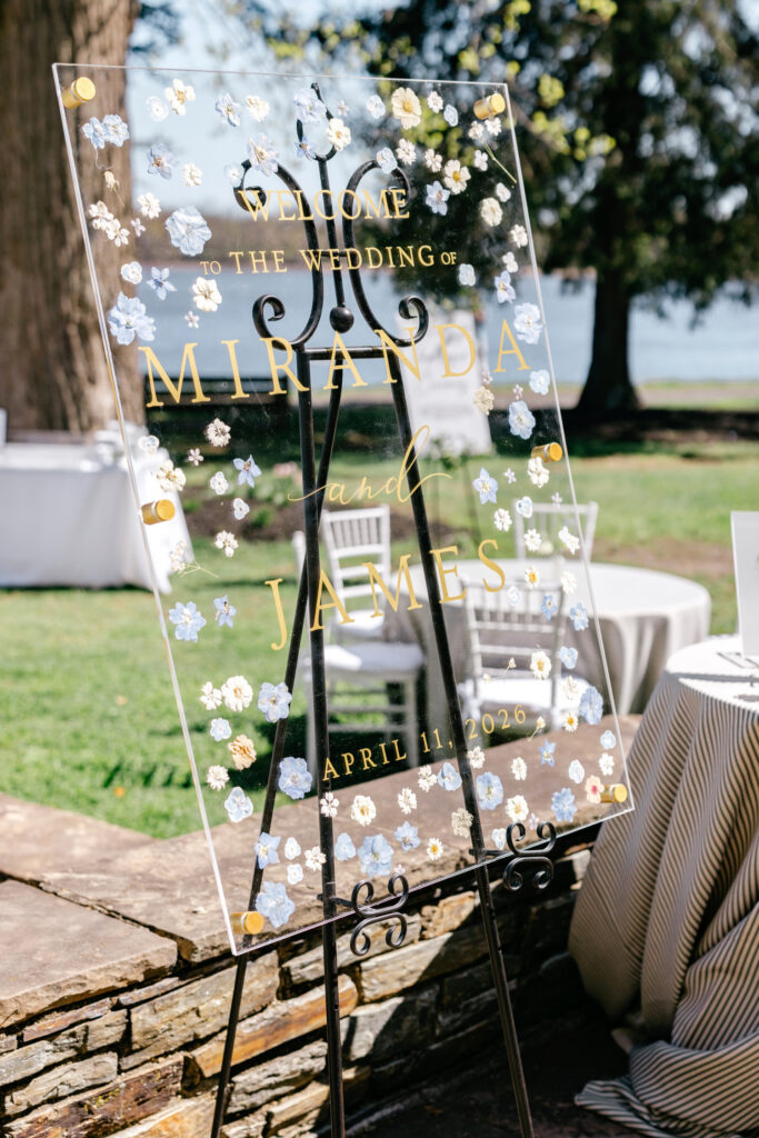 glass pressed floral wedding welcome sign for outdoor spring wedding by Emily Wren Photography