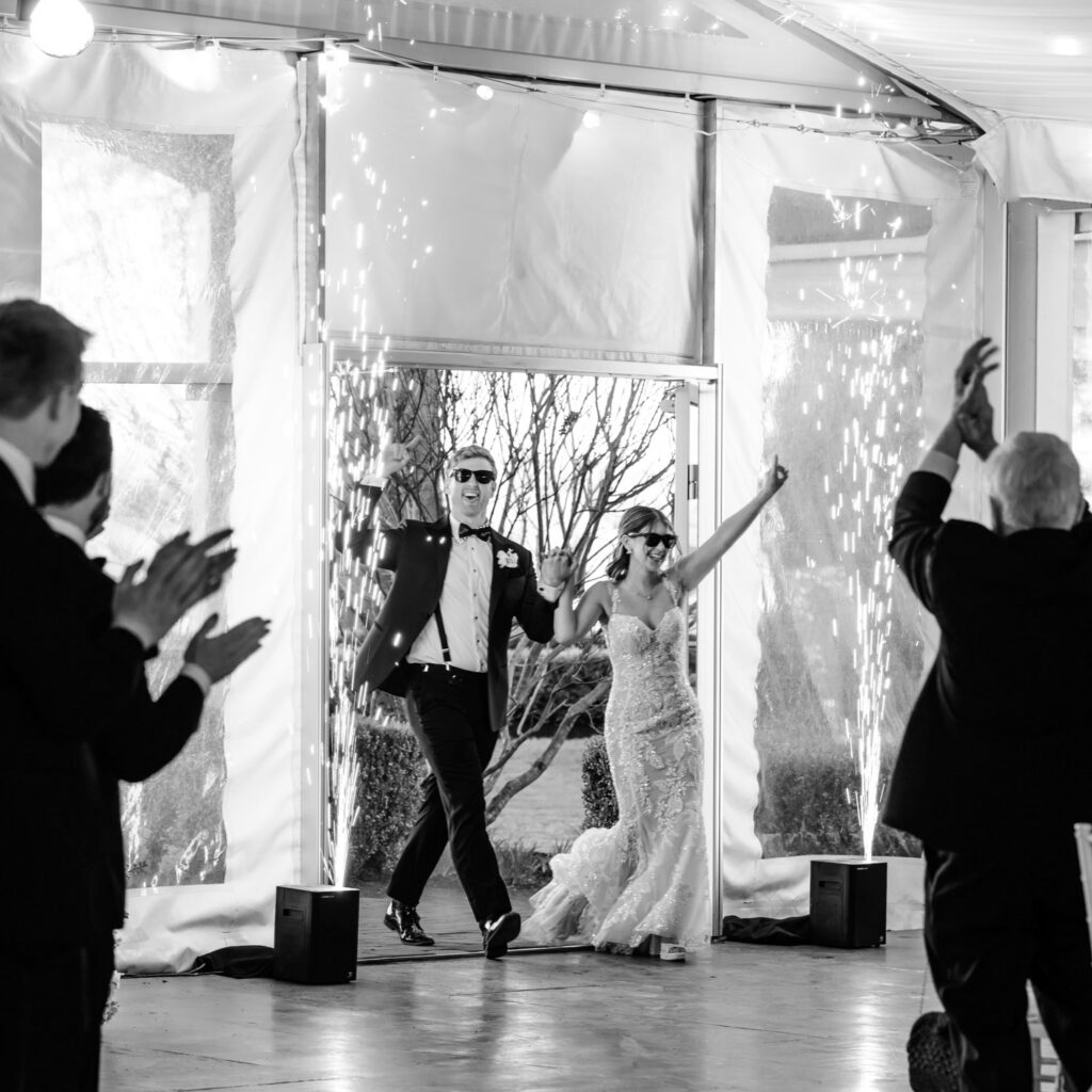 Philadelphia bride and groom entering their Glen Foerd wedding reception by Emily Wren Photography