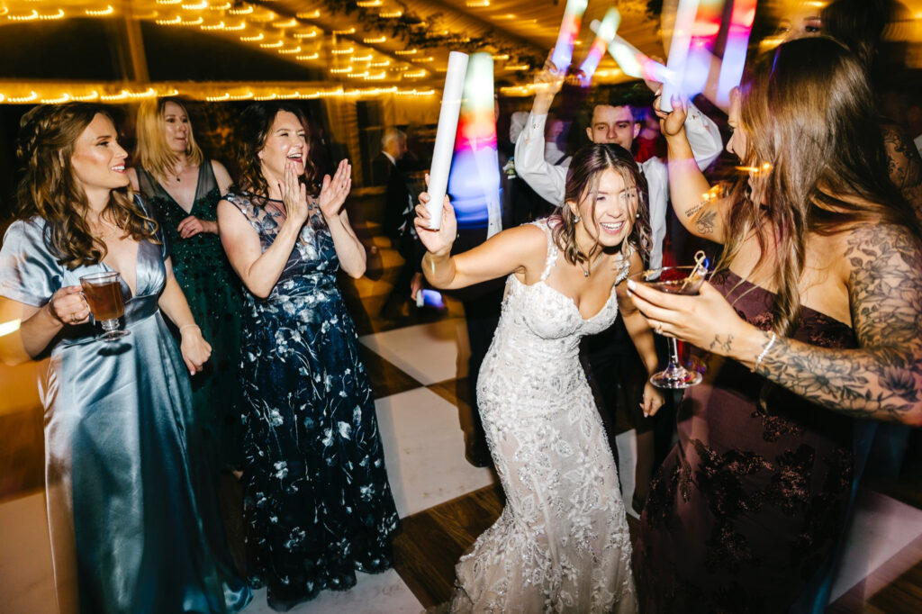Philadelphia bride having fun at her Glen Foerd wedding reception by Emily Wren Photography