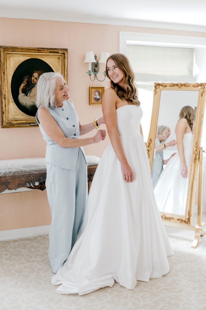 Philadelphia bride getting ready for her spring wedding day with her mother at Appleford Estate