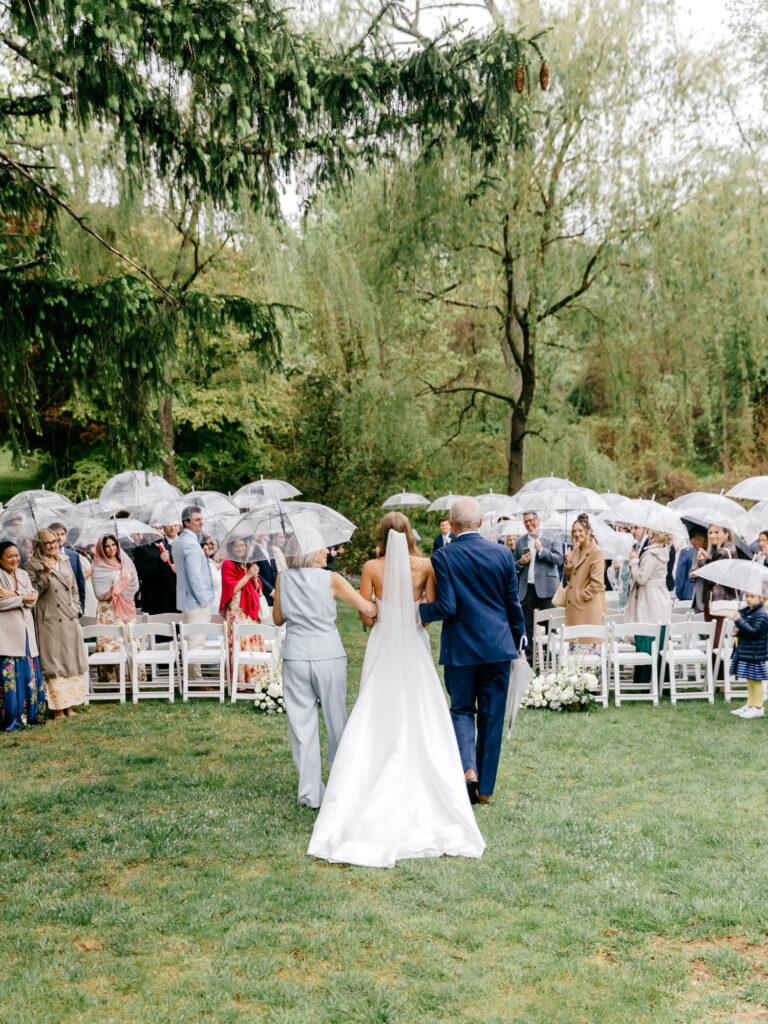 Main Line Philadelphia bride walking down the aisle at her outdoor garden wedding ceremony at Appleford Estate