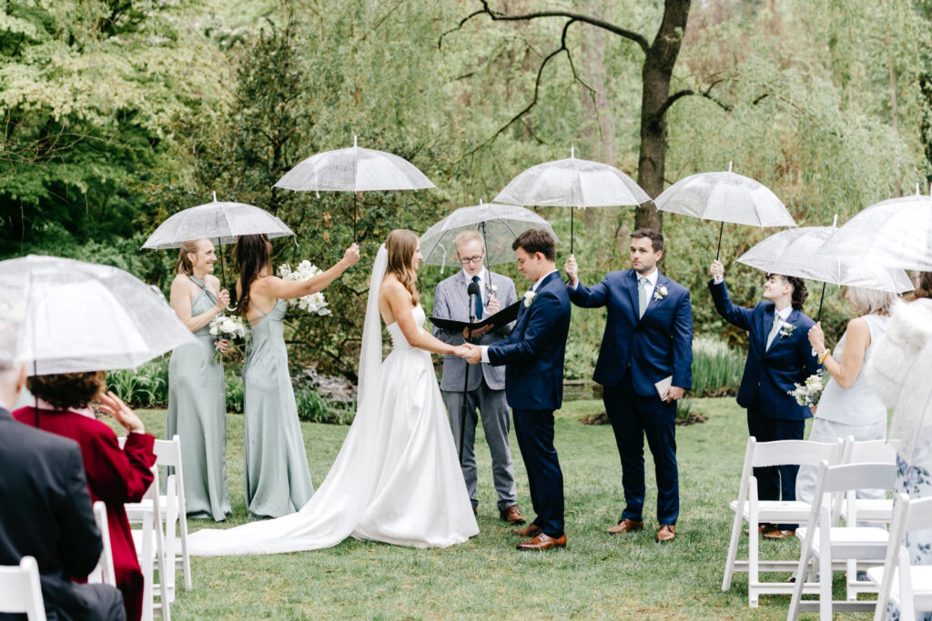 outdoor rainy garden wedding ceremony in Main Line Philadelphia