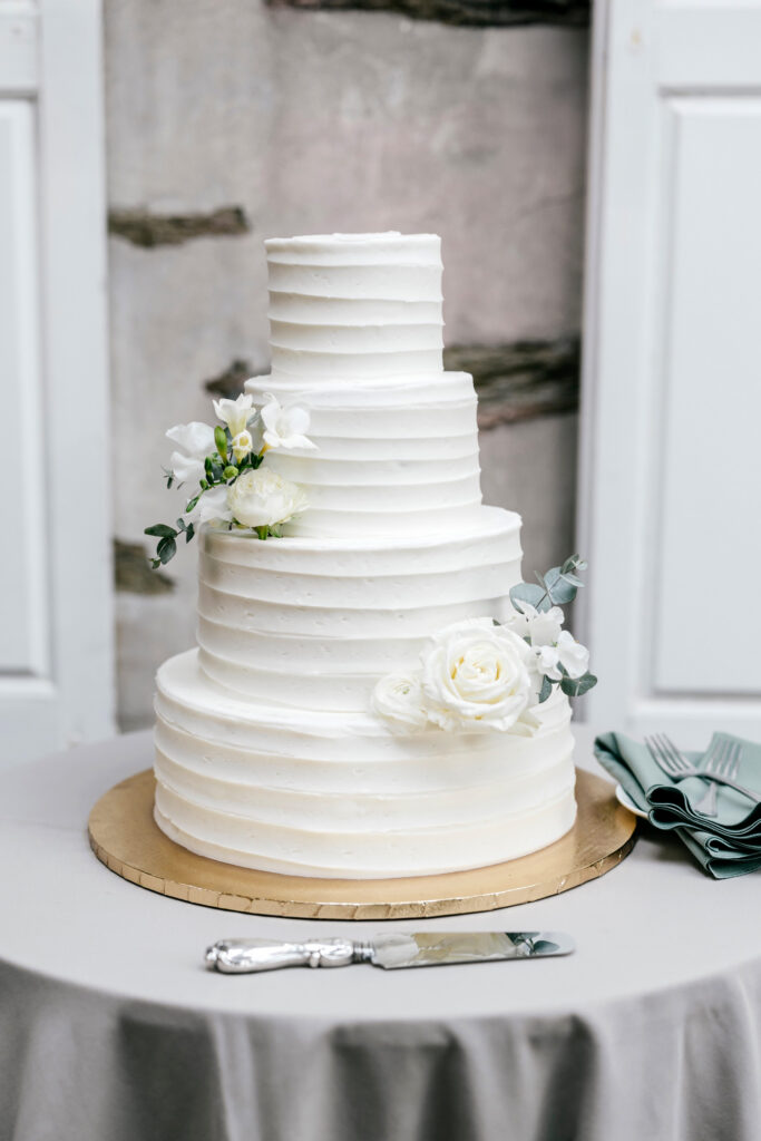 four tier simplistic wedding cake by Emily Wren Photography