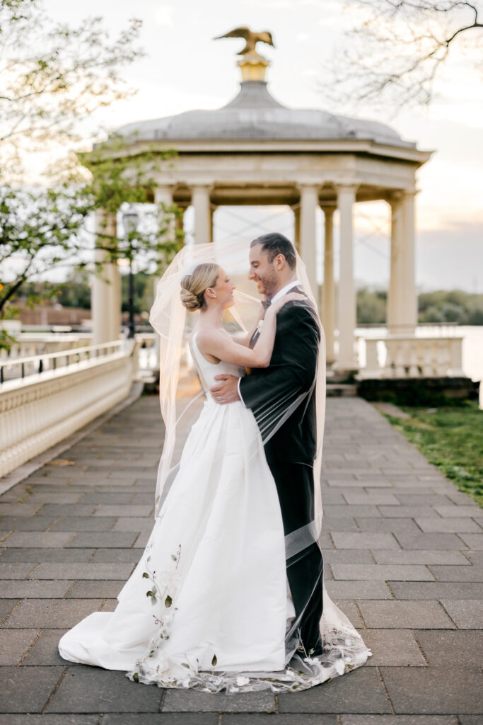 golden hour wedding portraits of Philadelphia bride and groom under the veil by luxury Philadelphia wedding photographer Emily Wren Photography