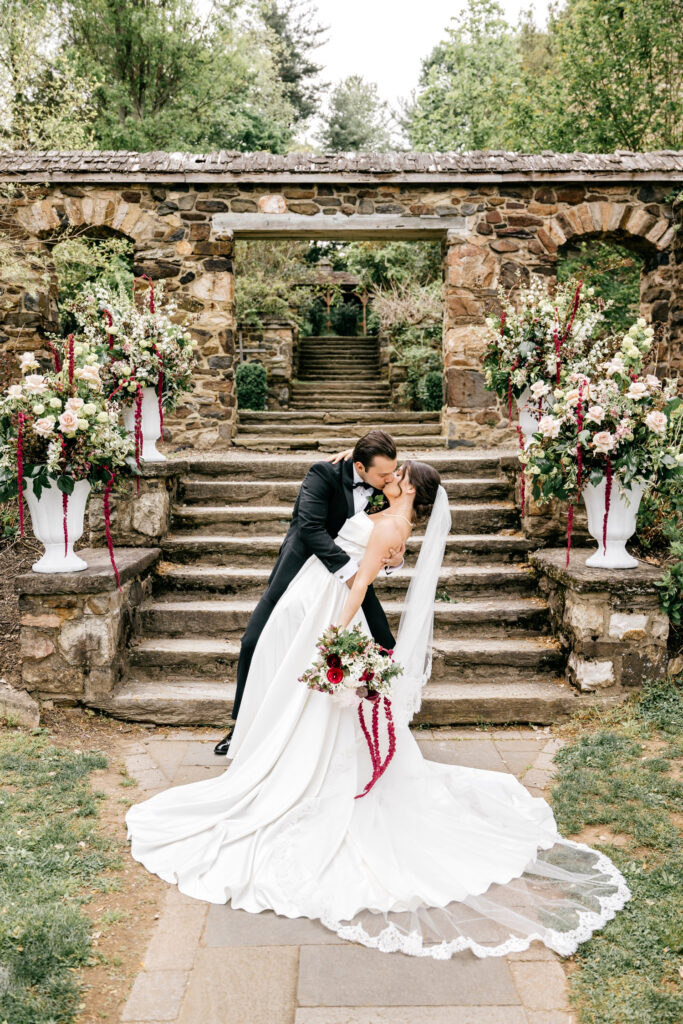 romantic spring wedding portraits at Parque Ridley Creek in front of wedding arch
