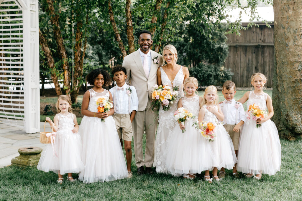 bride and groom with their flower girls and ring bearers at a Terrain Gardens wedding